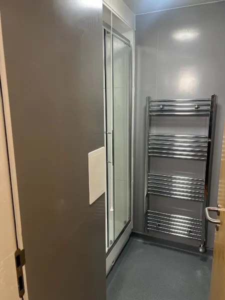 Photograph of a door leading to a bathroom in City Campus Standard Accommodation.