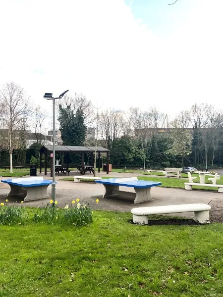 An outdoors area at Lomas Street accommodation for students to sit on provided benches or play ping-pong with the provided tables