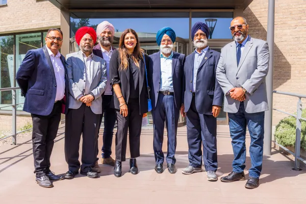 Thumbnail Image from the Research in Sikh Studies Conference June 2023 showing staff standing together outside the Lord Swraj Paul Building