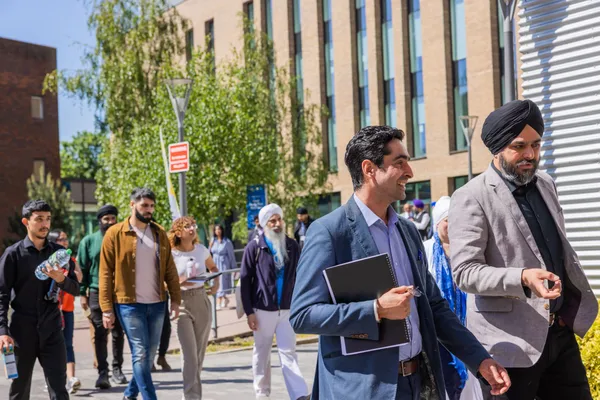 Thumbnail Image from the Research in Sikh Studies Conference June 2023 showing attendants leaving the Lord Swraj Paul Building