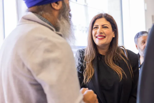 Thumbnail Image from the Research in Sikh Studies Conference June 2023 showing a conversation between a man and a woman