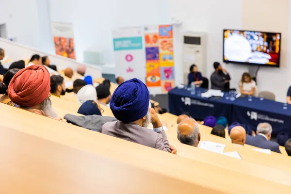 Thumbnail Image from the Research in Sikh Studies Conference June 2023 showing a lecture room from above during a presentation