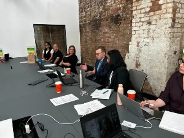 A DESIRE project discussion in progress, with participants sat around a table
