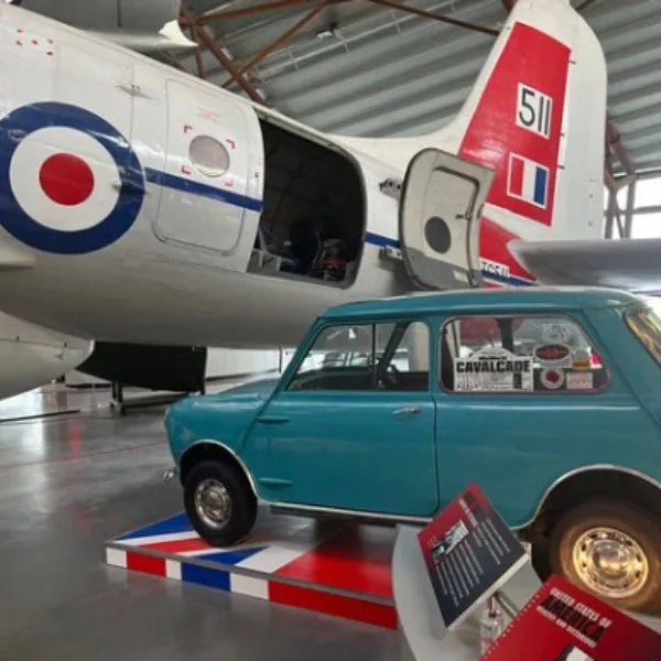 A plane and a vintage car on display at RAF Cosford
