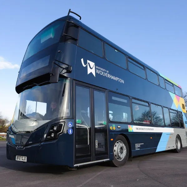 A dark blue double decker bus with University of Wolverhampton branding