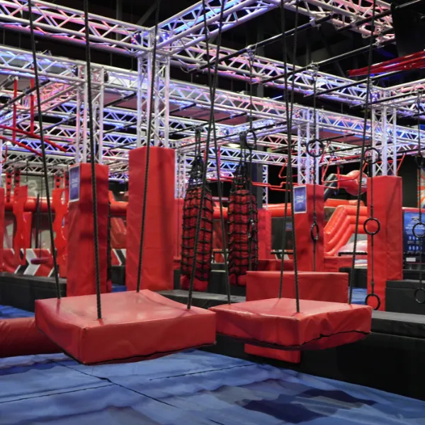 Ninja Warrior UK equipment: swinging red platforms, sandbags, climbing frames and other obstacles