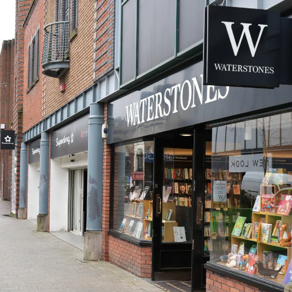 Exterior of Waterstones in Walsall, new hardback bestsellers in the window display