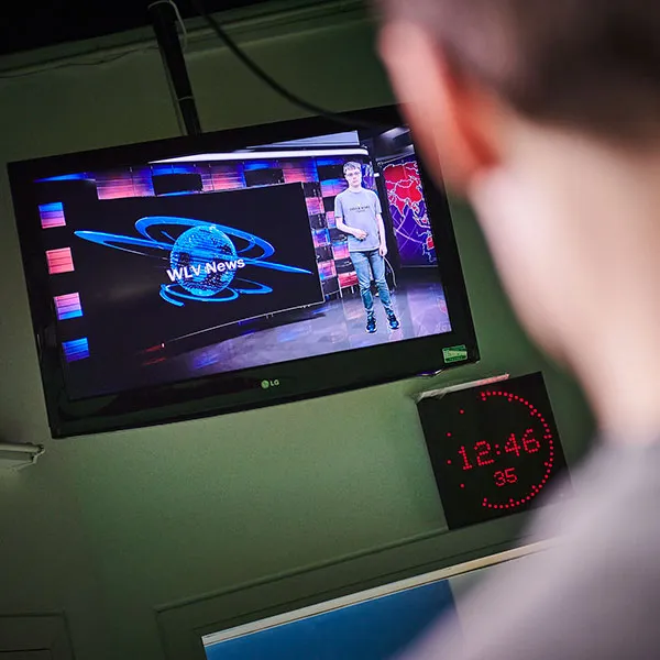 student using camera monitor