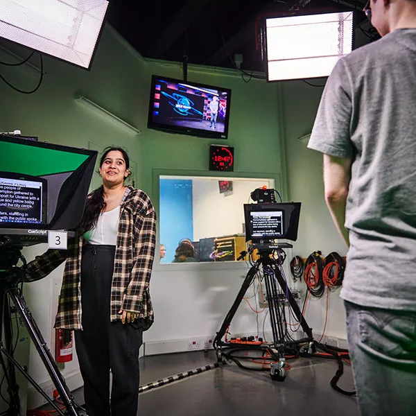 students using the journalism TV Studio