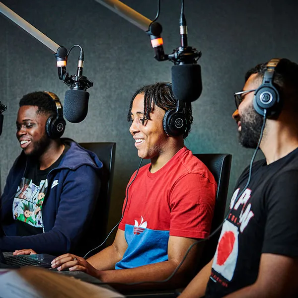 student recording in the radio studio