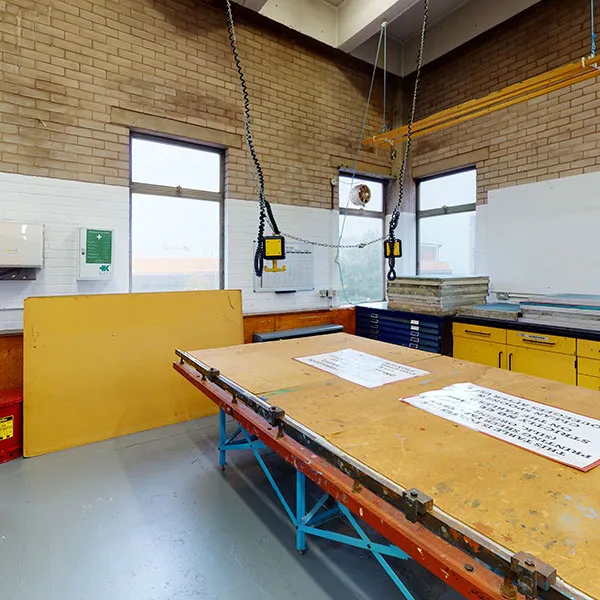 Panorama of the Textiles printing room, showing the large print beds that are used for printing onto a variety of fabrics