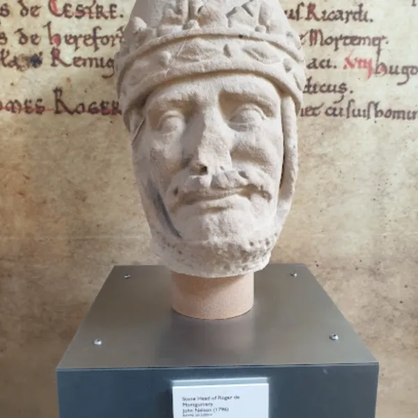 Statue head of Roger de Montgomery with a tapestry backdrop