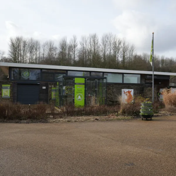 Telford Bike Hub, with green Cycle Station signage and a flag planted in the ground